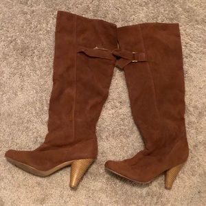 Brown heeled knee high boots